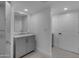 This bathroom features a gray vanity with gold hardware and a gold-framed mirror at 701 W Windsor Ave, Phoenix, AZ 85007