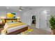 Light-filled bedroom with a walk-in closet and stylish decor at 701 W Windsor Ave, Phoenix, AZ 85007