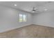 Bright bedroom featuring modern flooring, a ceiling fan, recessed lighting, and a large window at 701 W Windsor Ave, Phoenix, AZ 85007