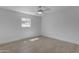 Bright bedroom features wood-look floors, a window, and a ceiling fan for a modern, comfortable space at 701 W Windsor Ave, Phoenix, AZ 85007
