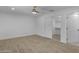Bedroom featuring modern flooring, a ceiling fan, recessed lighting, and closet and bathroom doors at 701 W Windsor Ave, Phoenix, AZ 85007