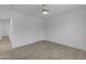This bedroom has wood-look floors, white walls, a ceiling fan, and closet doors at 701 W Windsor Ave, Phoenix, AZ 85007
