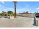 Beige home with large concrete driveway, two palm trees, and white picket fence in front yard at 701 W Windsor Ave, Phoenix, AZ 85007