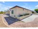 Beige home with concrete and paver driveway and planter in front at 701 W Windsor Ave, Phoenix, AZ 85007