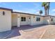 Beige home with front entrance and paver walkway surrounded by desert landscaping at 701 W Windsor Ave, Phoenix, AZ 85007