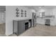 Stylish kitchen with stainless steel appliances and a wine rack at 701 W Windsor Ave, Phoenix, AZ 85007