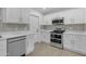 Well-equipped kitchen with stainless steel appliances and plenty of cabinet space at 701 W Windsor Ave, Phoenix, AZ 85007