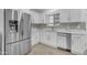 Modern kitchen featuring stainless steel appliances and white cabinetry at 701 W Windsor Ave, Phoenix, AZ 85007