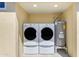 A convenient laundry room features a washer, dryer, and water heater for efficient home management at 701 W Windsor Ave, Phoenix, AZ 85007