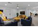 Bright living room features wood floors, stylish furniture, and modern decor at 701 W Windsor Ave, Phoenix, AZ 85007