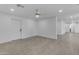 Spacious living room featuring modern flooring, a ceiling fan, recessed lighting, and a neutral color palette at 701 W Windsor Ave, Phoenix, AZ 85007