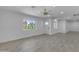 Bright living room featuring light wood flooring and white walls at 701 W Windsor Ave, Phoenix, AZ 85007