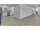 Open-concept living area with light wood floors and access to the kitchen at 701 W Windsor Ave, Phoenix, AZ 85007