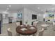 Open-concept living space with dining area, kitchen, and a connected seating area at 701 W Windsor Ave, Phoenix, AZ 85007
