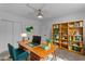 Bright office space with a large wood desk, bookcase, and ample natural light at 701 W Windsor Ave, Phoenix, AZ 85007