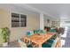 Outdoor dining area featuring a large table, comfortable seating, and ample shade at 701 W Windsor Ave, Phoenix, AZ 85007
