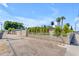View of the property showcasing its street-side landscaping with a decorative wrought iron fence and block wall at 701 W Windsor Ave, Phoenix, AZ 85007
