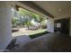Inviting patio leads to lush backyard featuring mature trees and pristine turf at 7126 W Ocotillo Rd, Glendale, AZ 85303