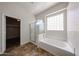 Bright bathroom featuring a separate shower and bathtub at 7126 W Ocotillo Rd, Glendale, AZ 85303