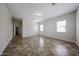 Bedroom with neutral walls, tile floors, and views of the backyard at 7126 W Ocotillo Rd, Glendale, AZ 85303