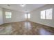 Bright bedroom with tile floors, neutral walls, and lots of natural light from multiple windows at 7126 W Ocotillo Rd, Glendale, AZ 85303