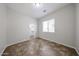 Bedroom with view to the walk-in closet and a large window at 7126 W Ocotillo Rd, Glendale, AZ 85303