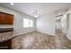 Open dining area featuring tile floors, a window, and a modern hanging light fixture at 7126 W Ocotillo Rd, Glendale, AZ 85303