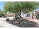 Charming single-story home featuring desert landscaping, trees, and well-kept surroundings at 7126 W Ocotillo Rd, Glendale, AZ 85303