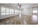 Bright living room with plantation shutters, neutral walls, and tile flooring at 7126 W Ocotillo Rd, Glendale, AZ 85303