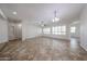 Bright living room with neutral walls, tile flooring, and recessed lighting at 7126 W Ocotillo Rd, Glendale, AZ 85303