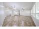 Spacious living room featuring neutral walls, tile flooring, and ample natural light at 7126 W Ocotillo Rd, Glendale, AZ 85303