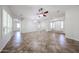 Spacious living room with neutral walls, tile flooring, and ceiling fan at 7126 W Ocotillo Rd, Glendale, AZ 85303