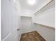 Walk-in closet with hanging rods and built in shelving at 7126 W Ocotillo Rd, Glendale, AZ 85303