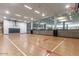 Spacious indoor basketball court with glossy wood floors, clear markings, and basketball hoops at 7137 E Rancho Vista Dr # 3007, Scottsdale, AZ 85251