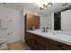 Well-appointed bathroom featuring a modern vanity with ample storage, a stylish mirror, and contemporary fixtures at 7137 E Rancho Vista Dr # 3007, Scottsdale, AZ 85251
