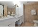 This bathroom features a double sink vanity with neutral walls and tiled floors at 7137 E Rancho Vista Dr # 3007, Scottsdale, AZ 85251