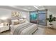 Serene bedroom with plush bedding, neutral tones, and a large window offering natural light and a view at 7137 E Rancho Vista Dr # 3007, Scottsdale, AZ 85251