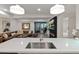 Bright kitchen area with a large countertop, stainless steel appliances, and a view into the living area at 7137 E Rancho Vista Dr # 3007, Scottsdale, AZ 85251