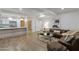 Open-concept living space showcasing a modern kitchen, comfortable seating, and sleek design elements throughout the space at 7137 E Rancho Vista Dr # 3007, Scottsdale, AZ 85251