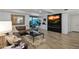 Cozy living room with a fireplace and mounted television, complemented by comfortable seating and contemporary design at 7137 E Rancho Vista Dr # 3007, Scottsdale, AZ 85251