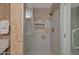 This bathroom features a glass enclosed shower with hexagon tile and gold hardware at 7137 E Rancho Vista Dr # 3007, Scottsdale, AZ 85251