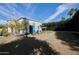 Expansive backyard featuring a seating area, lush lawn, mature trees, and manicured hedges at 7471 E Northern Ave, Scottsdale, AZ 85258