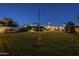 Large grassy backyard with basketball hoop and play structure at 7471 E Northern Ave, Scottsdale, AZ 85258
