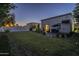 Beautiful backyard with lush lawn and patio seating at 7471 E Northern Ave, Scottsdale, AZ 85258