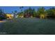 Lush backyard features a playset, basketball hoop, and plenty of green space for recreation and enjoyment at 7471 E Northern Ave, Scottsdale, AZ 85258