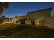 Backyard with pool, putting green, covered patio and well-maintained shrubbery at 7471 E Northern Ave, Scottsdale, AZ 85258