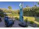 Backyard with a patio area, comfortable seating, and lush greenery for outdoor enjoyment at 7471 E Northern Ave, Scottsdale, AZ 85258