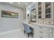 Bathroom vanity with a mirror, natural light, and built-in storage at 7471 E Northern Ave, Scottsdale, AZ 85258