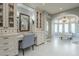 Spacious bathroom featuring vanity area, shelving for storage, and soaking tub at 7471 E Northern Ave, Scottsdale, AZ 85258