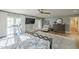 Bedroom featuring hardwood floors, a ceiling fan, a large screen tv, and French doors to the outside at 7471 E Northern Ave, Scottsdale, AZ 85258